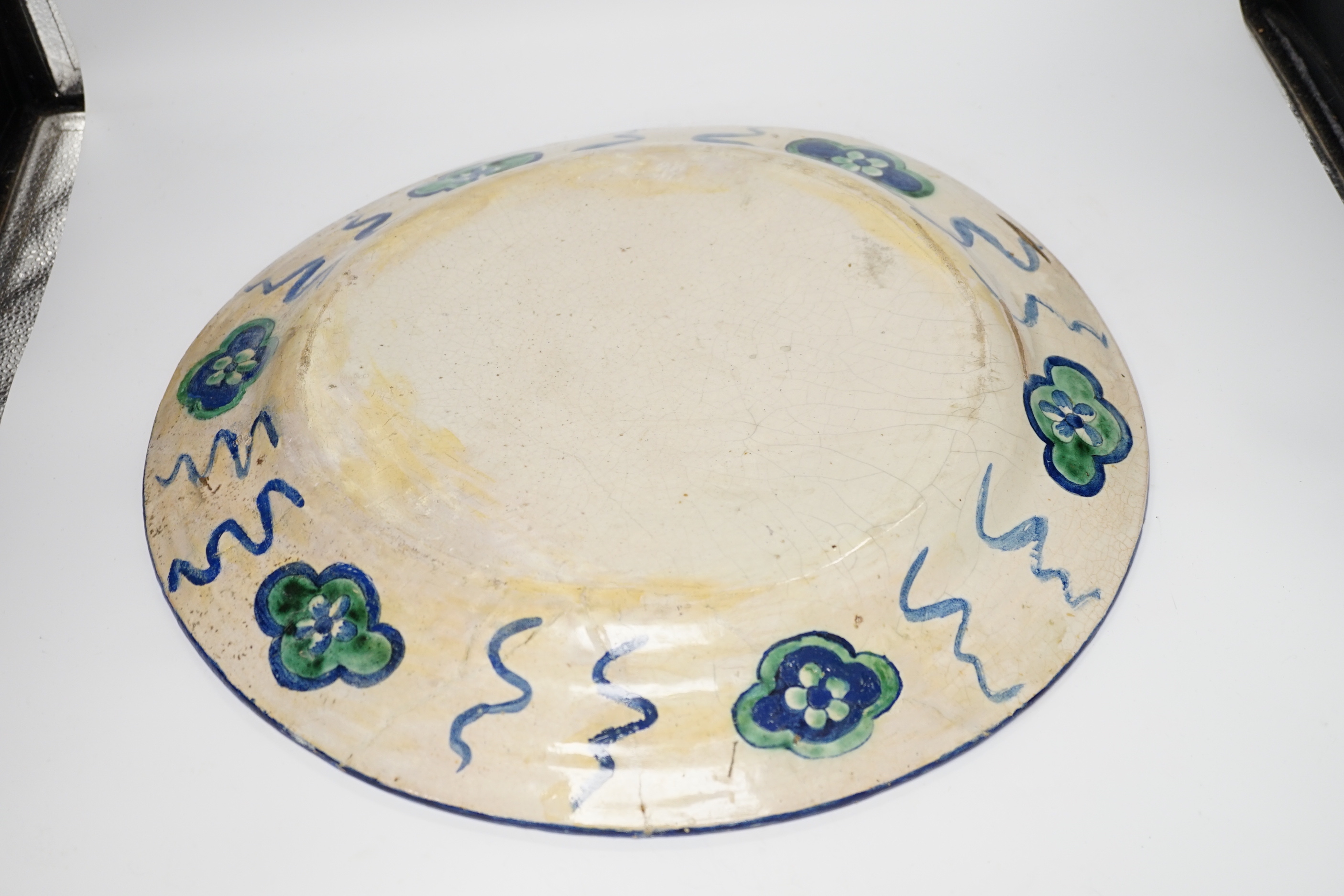 A late 19th century Italian charger in Iznik style, 45cm in diameter